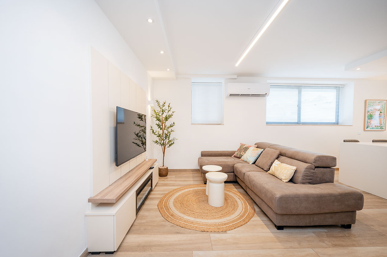 Living room with corner sofa and Smart TV