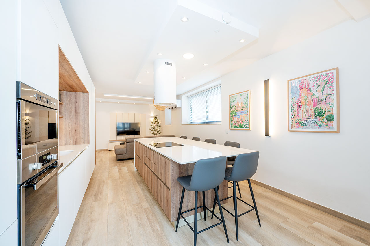 Kitchen with island and open view to living area