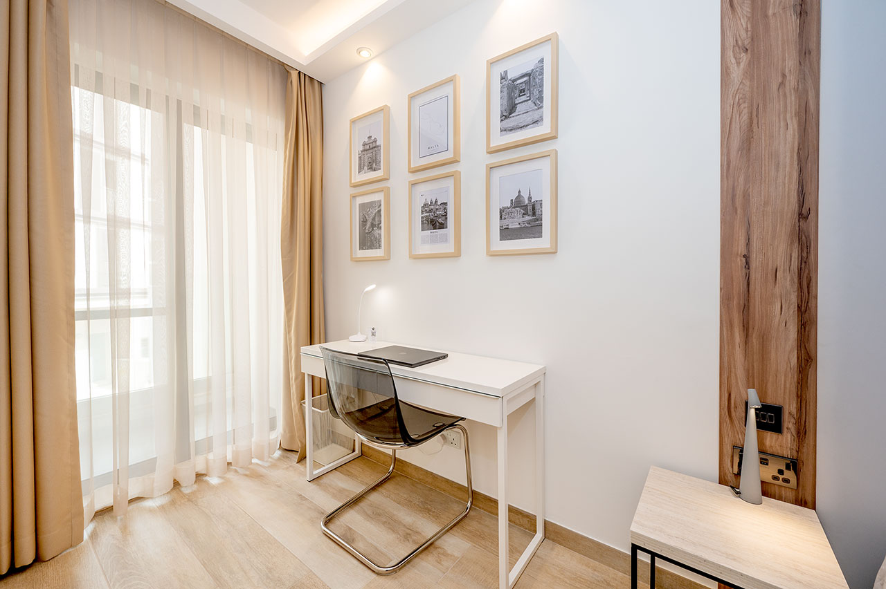 Dedicated workspace with desk and natural light